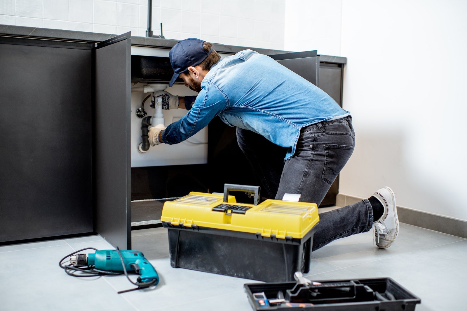 man-repairing-kitchen-furniture-1