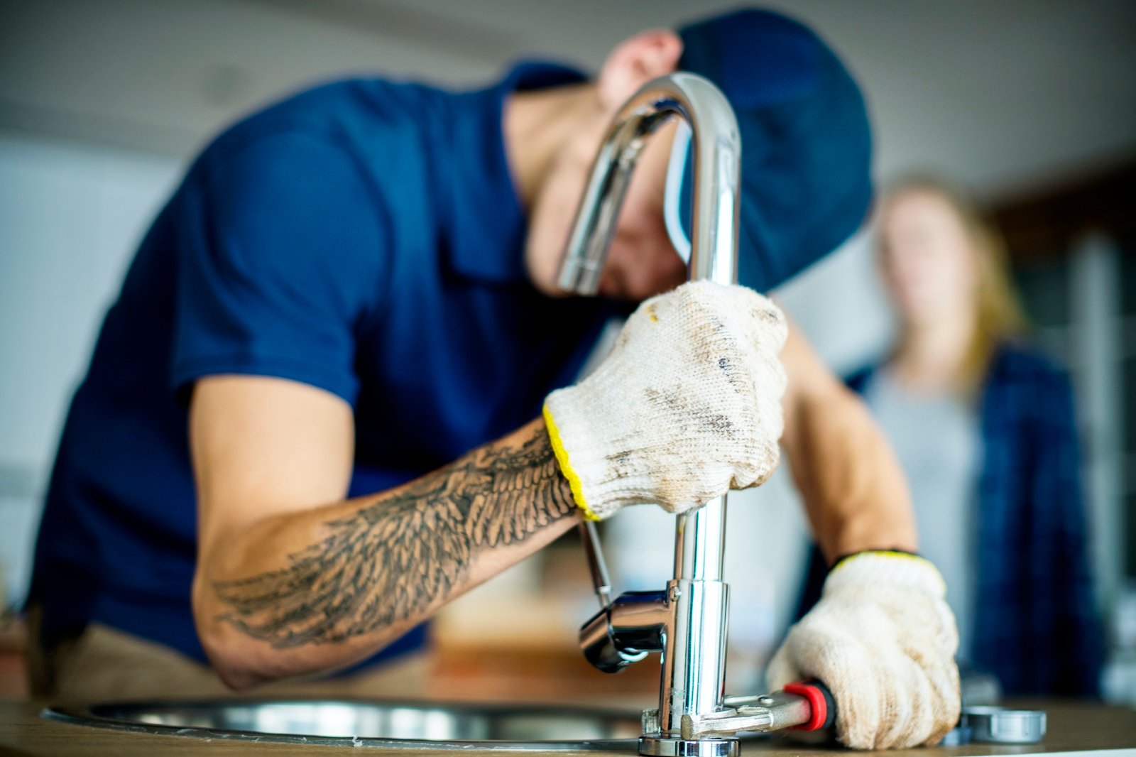 plumber-fixing-kitchen-sink-1